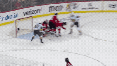 A Hockey Game Is Being Played With Ads For Prudential And Verizon GIF