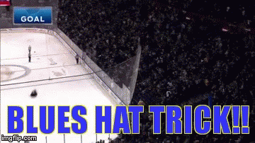 A Hockey Game Is Being Played With The Words Blues Hat Trick On The Ice GIF