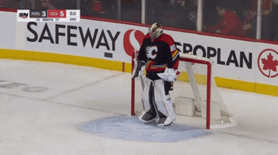 A Hockey Goalie Stands In Front Of A Safeway Banner GIF