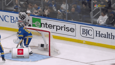 A Hockey Goalie Stands In Front Of A Toyota Sign GIF