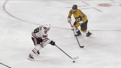 A Hockey Goalie With The Number 7 On His Jersey GIF