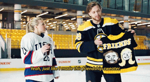 A Hockey Player Holding A Sweater That Says Friends On It GIF