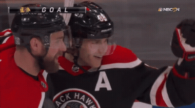 A Hockey Player In A Black And Red Jersey With The Letter A On It GIF