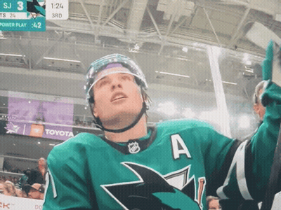 A Hockey Player In A Green Jersey With The Letter A On The Front GIF