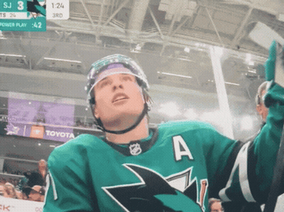 A Hockey Player In A Green Jersey With The Letter A On The Front GIF
