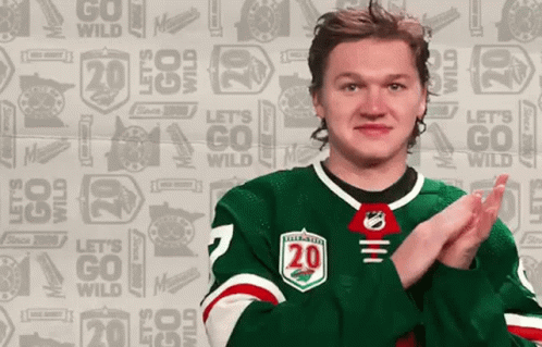 A Hockey Player In A Green Jersey With The Number 20 On It GIF