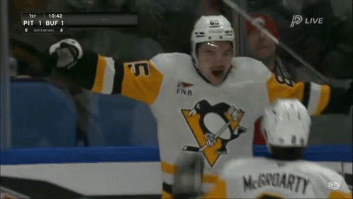A Hockey Player In A Pittsburgh Penguins Jersey Celebrates His Goal GIF