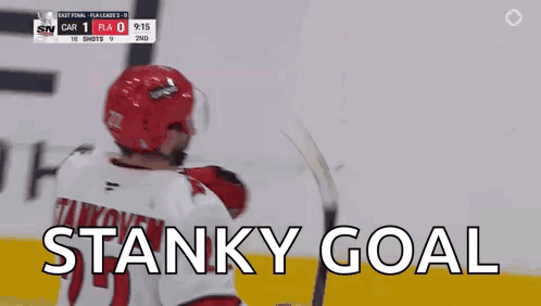 A Hockey Player In A Red Helmet Is Celebrating A Stanky Goal . GIF