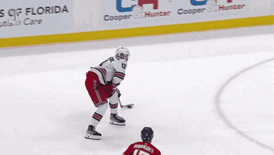 A Hockey Player In A Red Jersey With Rodriguez On The Back GIF