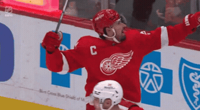 A Hockey Player In A Red Jersey With The Letter C On The Front GIF