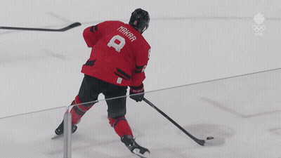 A Hockey Player In A Red Jersey With The Number 8 On It GIF