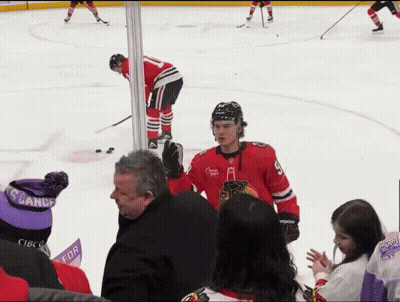 A Hockey Player In A Red Jersey With The Number 9 On The Front GIF