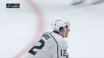 A Hockey Player In A White Jersey With The Number 22 On It GIF