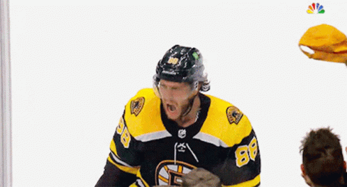 A Hockey Player Is Being Thrown In The Air By A Crowd GIF