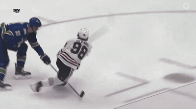 A Hockey Player Is Laying On The Ice With The Sn Logo On The Bottom Right GIF