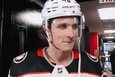 A Hockey Player Is Wearing A Helmet That Says Bauer GIF