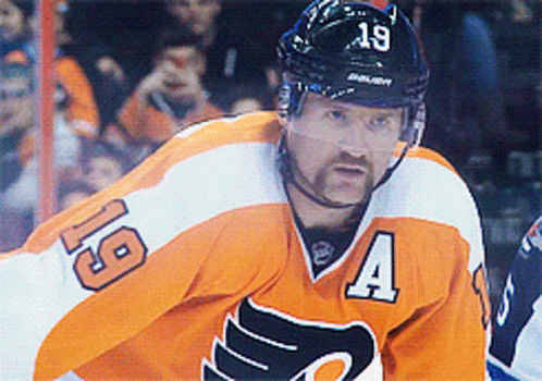 A Hockey Player Is Wearing A Jersey With The Number 19 On It GIF
