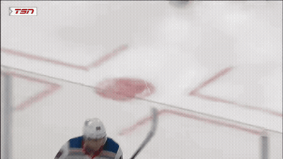 A Hockey Player Is Wearing A Rangers Jersey And Holding A Stick GIF