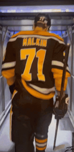 A Hockey Player Named Halkin Is Walking Down A Tunnel GIF