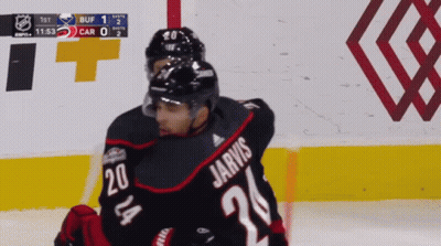 A Hockey Player Named Jarvis Is Hugging Another Hockey Player GIF