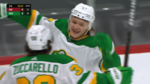 A Hockey Player Named Tuccarello Is Hugging Another Hockey Player GIF