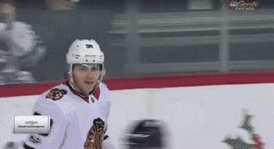 A Hockey Player On The Ice With A Nbc Sports Chicago Advertisement In The Corner GIF