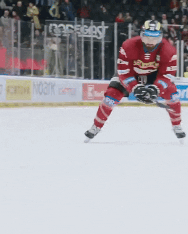 A Hockey Player On The Ice With A Sign That Says Noark In The Background GIF