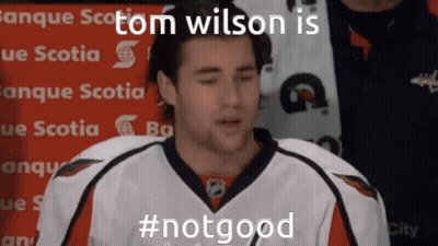 A Hockey Player Says Tom Wilson Is #Notgood In Front Of A Sign That Says Banque Scotia GIF