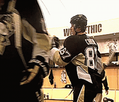 A Hockey Player Stands In Front Of A Sign That Says " Westthic " GIF