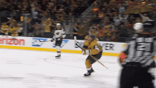 A Hockey Player Stands On The Ice In Front Of A Verizon Advertisement GIF