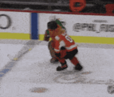 A Hockey Player Stands On The Ice In Front Of An Advertisement For Bhhub GIF