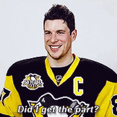 A Hockey Player Wearing A Black And Yellow Jersey With The Letter C On It GIF