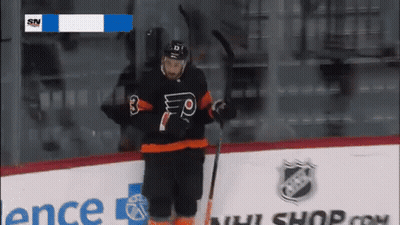A Hockey Player Wearing A Black Jersey With The Number 3 On It GIF