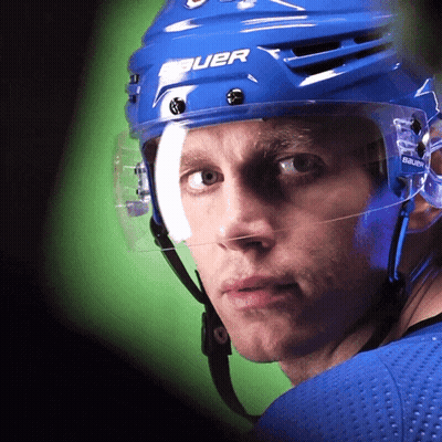 A Hockey Player Wearing A Blue Helmet That Says Bauer On It GIF