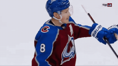 A Hockey Player Wearing A Blue Helmet With The Letter C On His Chest GIF