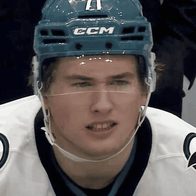 A Hockey Player Wearing A Blue Helmet With The Letters Ccm On It GIF