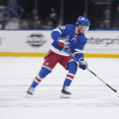 A Hockey Player Wearing A Blue Jersey With The Number 21 On It GIF