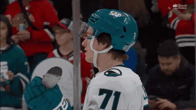 A Hockey Player Wearing A Blue Sap Helmet GIF