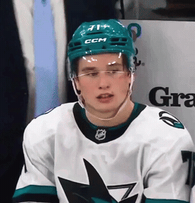 A Hockey Player Wearing A Ccm Helmet And Glasses GIF