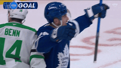 A Hockey Player Wearing A Green Jersey With The Number 14 On It GIF