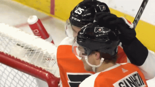 A Hockey Player Wearing A Helmet That Says 25 On It GIF