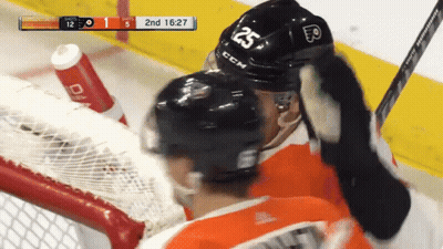 A Hockey Player Wearing A Helmet That Says 25 On It GIF