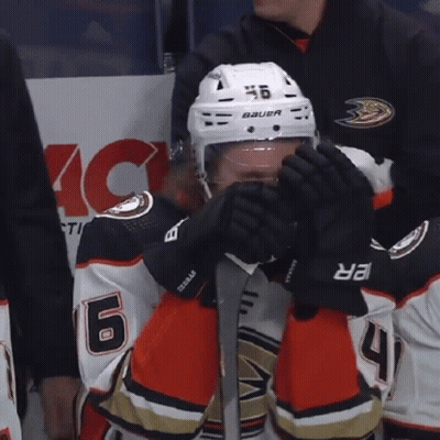 A Hockey Player Wearing A Helmet That Says Bauer On It GIF