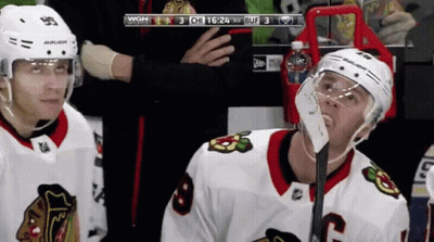 A Hockey Player Wearing A Helmet That Says Bauer On It GIF