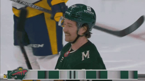 A Hockey Player Wearing A Helmet That Says Toyota GIF