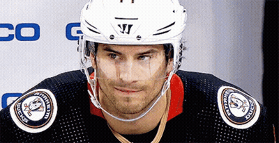 A Hockey Player Wearing A Helmet That Says Warrior On It GIF