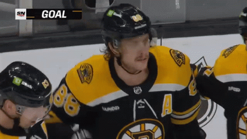 A Hockey Player Wearing A Jersey That Has The Number 88 On It GIF