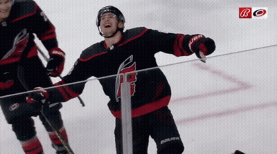 A Hockey Player Wearing A Jersey That Says Bauer Is Standing On The Ice GIF