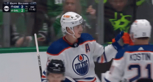 A Hockey Player Wearing A Jersey That Says Edmonton Oilers On It GIF