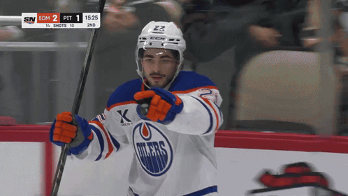 A Hockey Player Wearing A Jersey That Says Oilers On It GIF